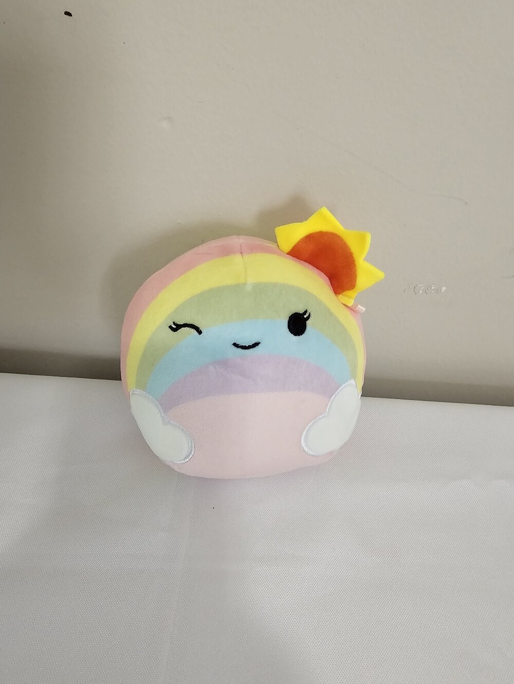 Squishmallows Pastel Rainbow Plush Pillow with Yellow Sun Accent
